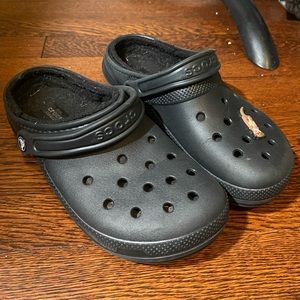 Lined fuzzy crocs with cute otter charm!